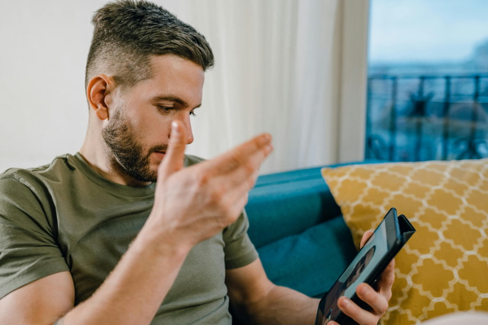 guy getting help about divorce remotely on tablet